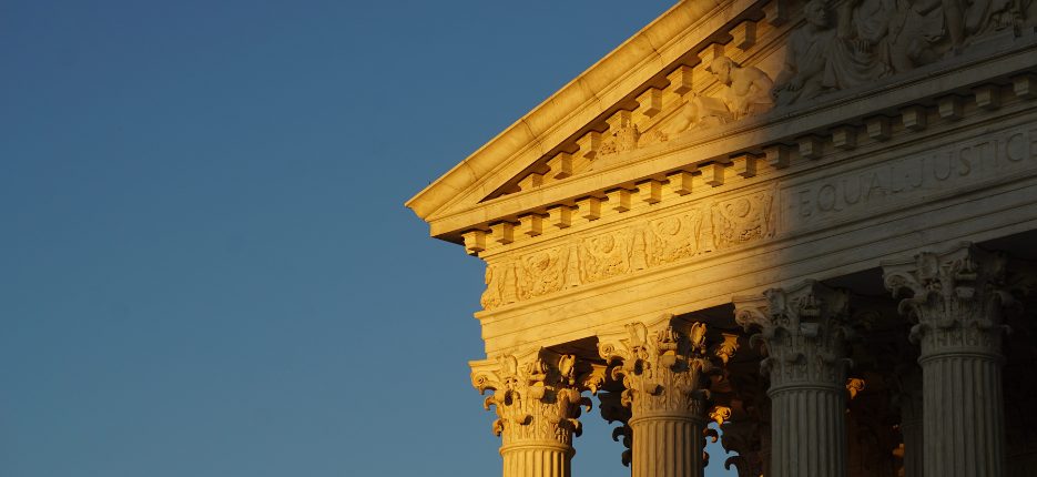 Top of the Supreme Court Building in half sun.