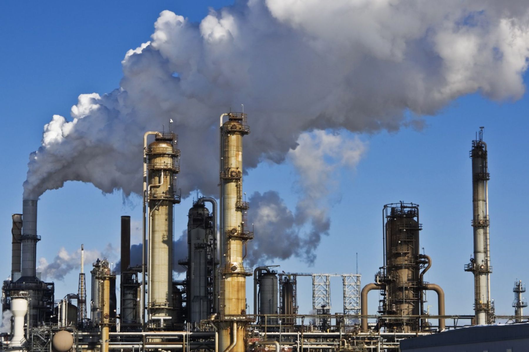 A power plant emitting clouds of pollutants.