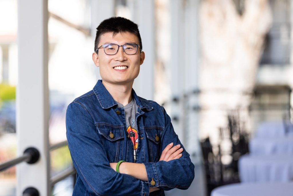 Dr. Jason Wang smiles at camera.