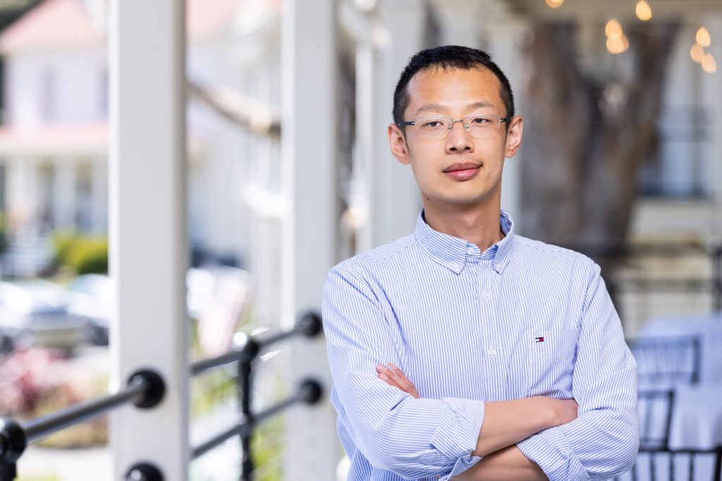 Dr. Songhu Wang smiles at camera.